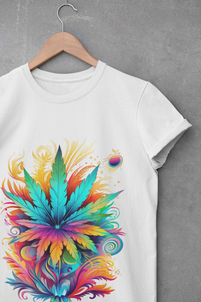 May include: White t-shirt with a colorful graphic of a marijuana leaf surrounded by swirls and abstract designs.