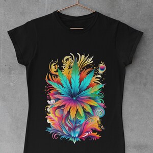 May include: A black t-shirt with a colorful graphic of a marijuana leaf surrounded by swirls and floral designs.