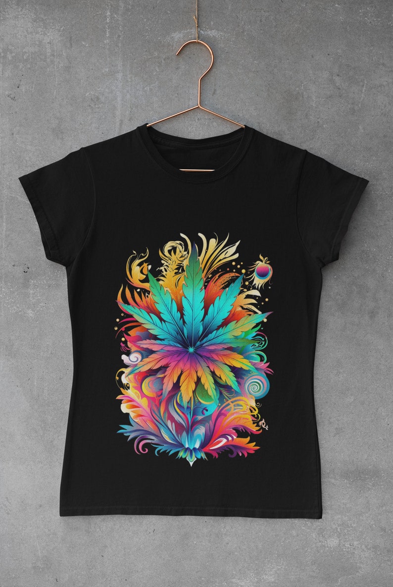 May include: A black t-shirt with a colorful graphic of a marijuana leaf surrounded by swirls and floral designs.