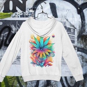 May include: White hooded sweatshirt with a colorful graphic print of a marijuana leaf with swirls and abstract designs.