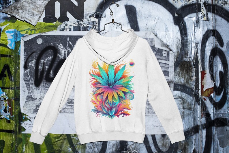 May include: White hooded sweatshirt with a colorful graphic print of a marijuana leaf with swirls and abstract designs.
