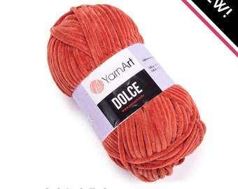 May include: A ball of YarnArt Dolce yarn in a terracotta orange color. The label reads "YarnArt Dolce" and "100g 120m".