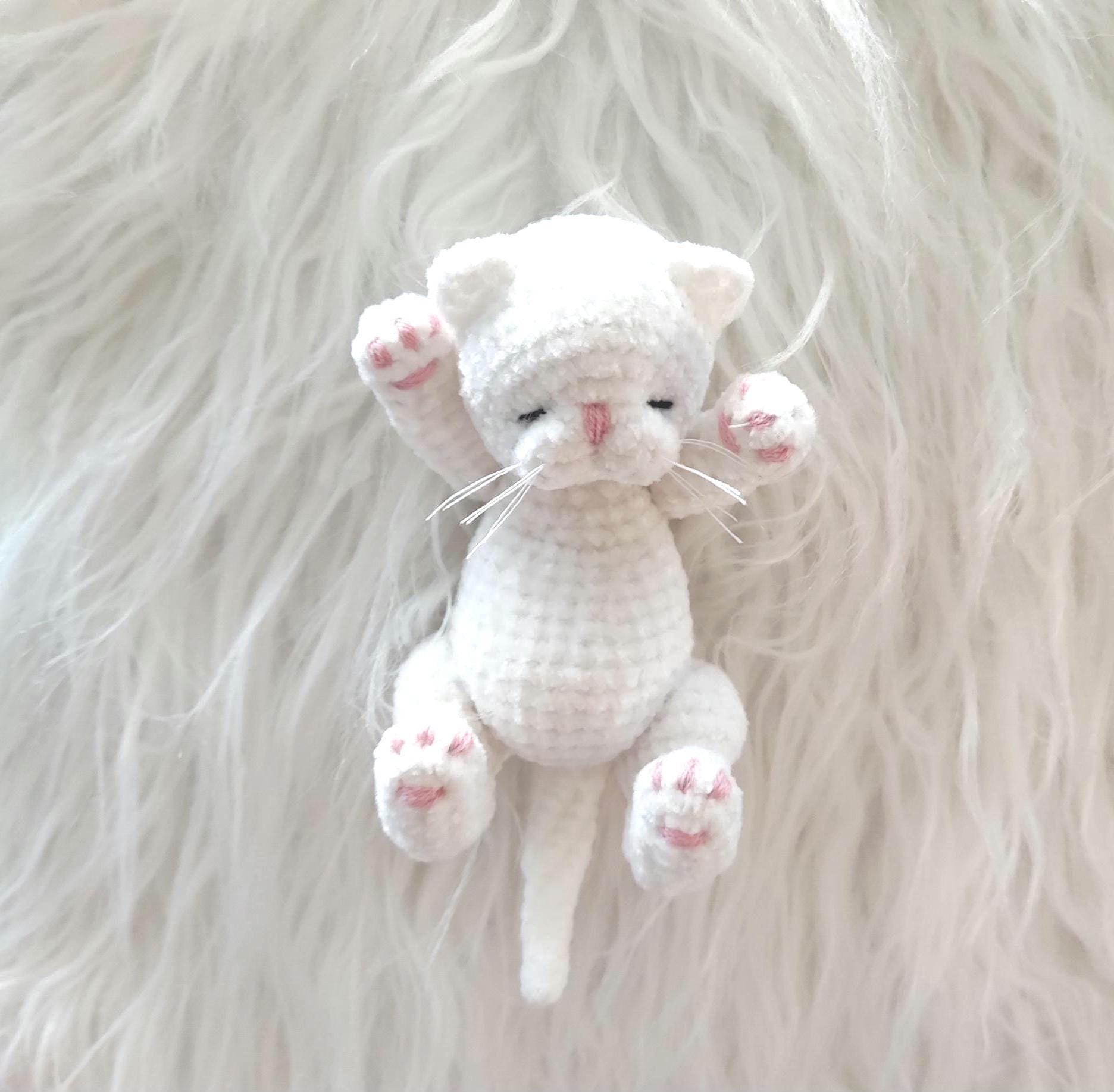 Tiny mini plush white cat, miniature pet, realistic toy kitten