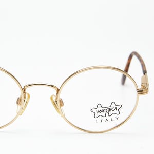 Occhiali da vista rotondi vintage Luxottica J.Bous 73 in oro e tartaruga, montatura in filo dorato, anni '80, mai indossati.