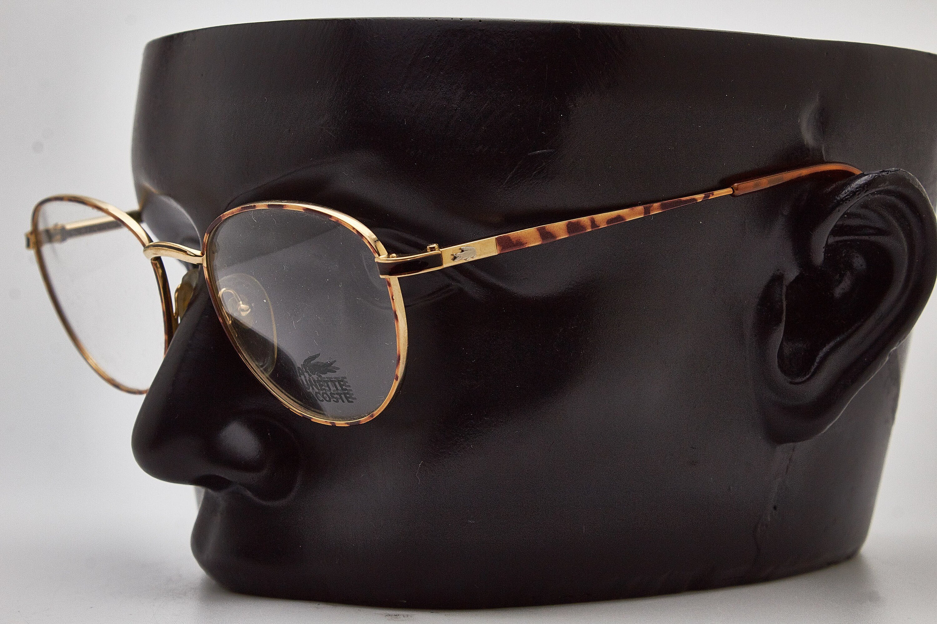 Lacoste gold frame glasses 2025