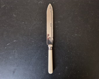 Vintage Faux Bone Handled Cake/ Bread Knife - 8.5 Inches