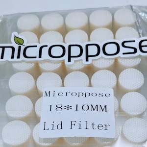 May include: A pack of 18 white, round, 10mm lid filters for use with micropose products. The pack is labelled "Micropose 18*10MM Lid Filter".