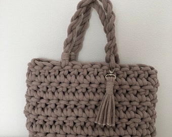 crocheted bag that can also be worn over the shoulder