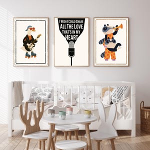 May include: Three framed art prints with a whimsical theme. One features a goose playing a guitar and wearing roller skates. Another displays the text "I wish I could share all the love that's in my heart." The third shows raccoons playing a trumpet.