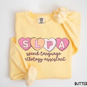 Speech Therapist Assistant Comfort Colors Sweatshirt Valentine Sweetheart SLPA Therapy Pathology Grad Gift Pathologist Cute Language Heart