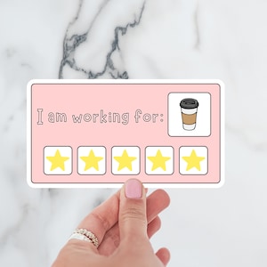 May include: A pink sticker with the text "I am working for:" and five yellow stars. A cartoon coffee cup is in the top right corner.