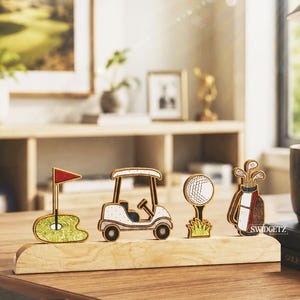 May include: Wooden golf-themed desk decor featuring a golf cart, golf ball, golf clubs, and a flag on a green. The set is displayed on a wooden base. The text "SWIDGETZ" is visible on the golf bag.
