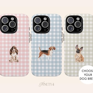 May include: Three phone cases with dog illustrations. Each case has a gingham pattern in pink, blue, and green. The cases feature a Cocker Spaniel, Beagle, and French Bulldog. The text "CHOOSE YOUR DOG BREED" is also visible.