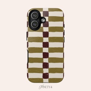 May include: A phone case with a geometric pattern of olive green and burgundy rectangles and stripes on an off-white background. The case has a camera cutout and the word "Ninety4" in script.