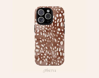 May include: A brown phone case with a white spotted pattern. The case has a glossy finish and a camera cutout with three lenses. The brand name "Ninety4" is printed at the bottom of the case.