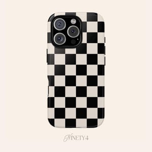 May include: A smartphone case with a black and cream checkerboard pattern. The case has a glossy finish and features a camera module with multiple lenses. The brand name "Ninety4" is printed at the bottom in a script font.