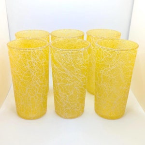 May include: Set of six yellow glasses with a white crackle pattern.