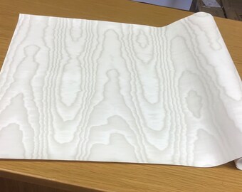 Toile à reliure : effet soie moirée blanc doux.