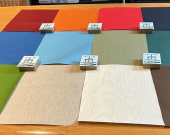 Assortiment de toiles de reliure : 12 panneaux, textures, épaisseurs et couleurs variés