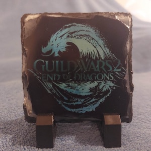 Posavasos o adornos de pizarra de Guildwars. Es genial tenerlos
