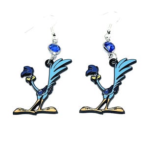 May include: A pair of silver earrings featuring a cartoon roadrunner with blue and yellow accents. Each earring has a blue crystal charm.