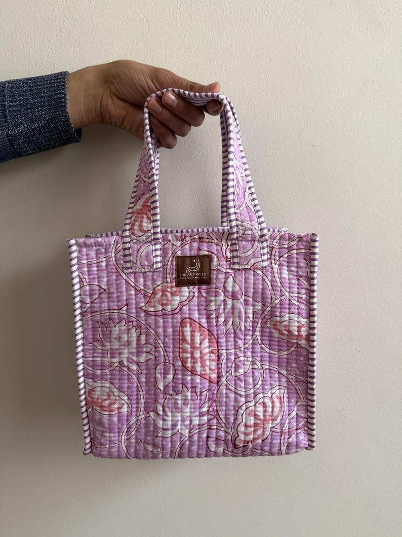Lavender hand block printed quilted mini tote bag with purple striped trim and soft padded cotton handles.