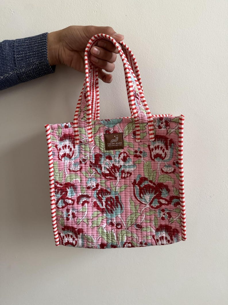 Pink floral hand block printed quilted mini tote bag with red striped binding and padded cotton handles