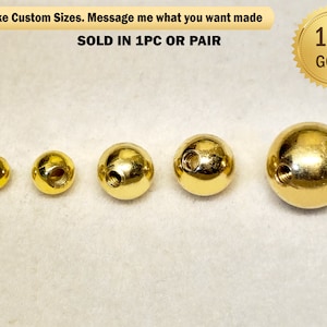 Op de afbeelding: Vier gouden metalen ballen van verschillende groottes met schroefdraadgaten. De ballen zijn gerangschikt in een rij van klein naar groot. De tekst "14K GOLD" is zichtbaar in de rechterbovenhoek van de afbeelding.