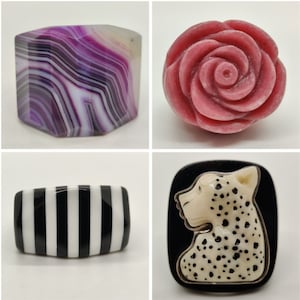 May include: Four different ring designs. The first ring is made of purple and white agate. The second ring is a pink rose. The third ring is black and white striped. The fourth ring is a black and white cheetah print.