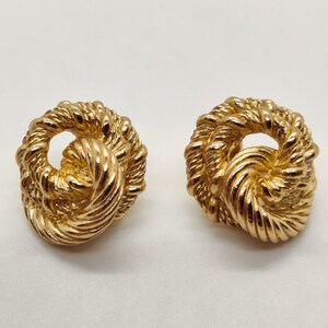 CHRISTIAN DIOR  Gold Textured Love Knot Pierced Earrings