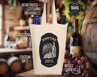 May include: A white canvas wine tote bag with reinforced stitching on the handles. The bag features a black and white logo with the text "Ashford Mobile Wine Co. Est. 2024". The bag has boxed corners.