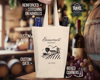 May include: A white canvas wine tote bag with reinforced stitching on the handles. The bag features a black and white illustration of a vineyard with a house and the text "Beaumont vineyard est. 2024".