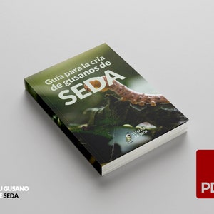 May include: A guide to raising silkworms, with a green and brown silkworm on a leaf. The cover of the guide has the text "Guia para la cria de gusanos de SEDA" and a logo with the text "TU GUSANO DE SEDA".