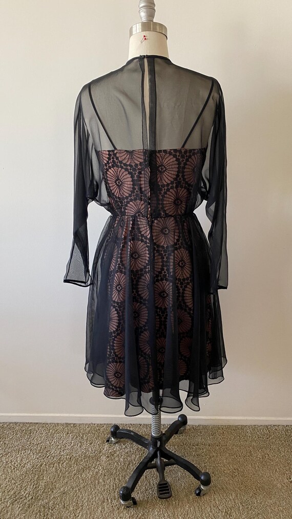 black lace dress with pink underlay Black lace with pink under dress