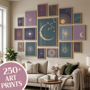 May include: A gallery wall arrangement of seventeen framed art prints featuring celestial themes with moons, suns, and stars in shades of blue, purple, and gold. The prints are displayed in light wood frames on a plain wall above a beige sofa.