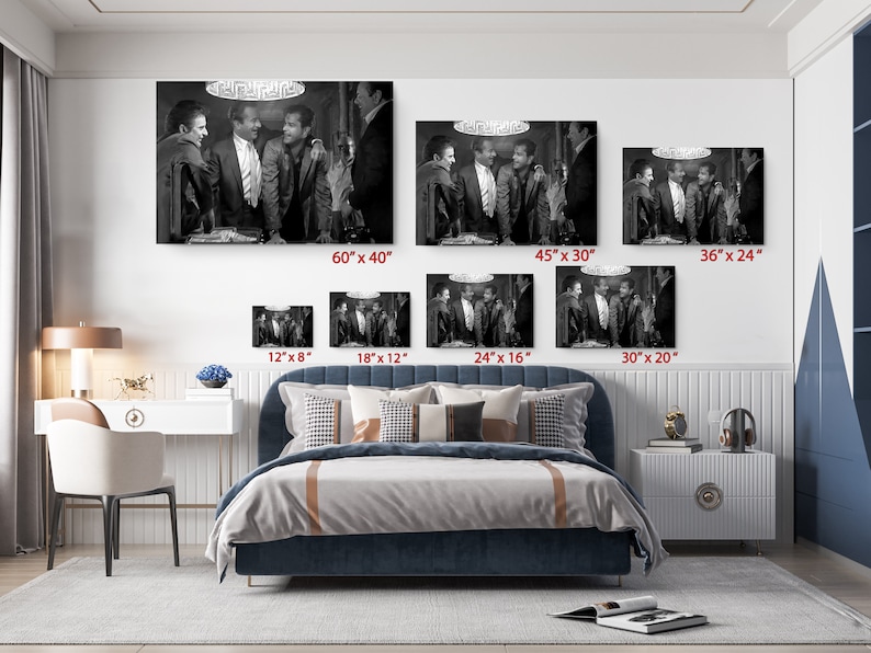 a bed room with a neatly made bed and pictures on the wall