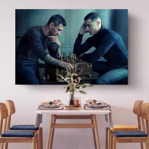 a couple of men sitting at a table next to each other