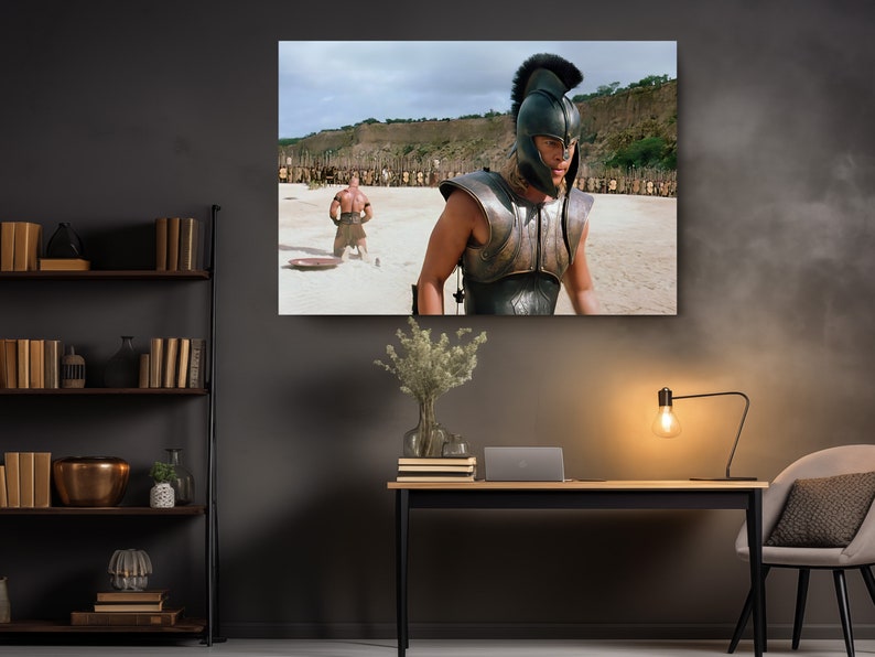 a room with a desk, chair, and a poster of a man in a