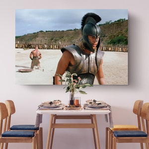 a table with chairs and a painting on the wall