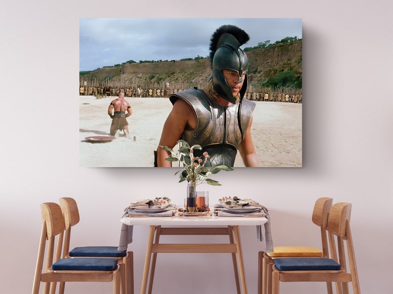 a table with chairs and a painting on the wall