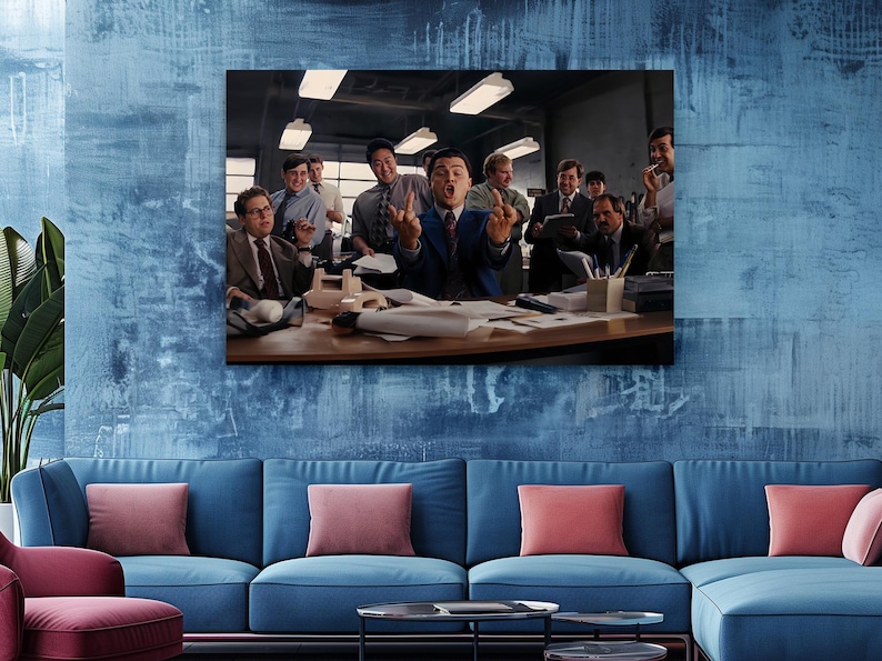 a group of people standing around a blue couch