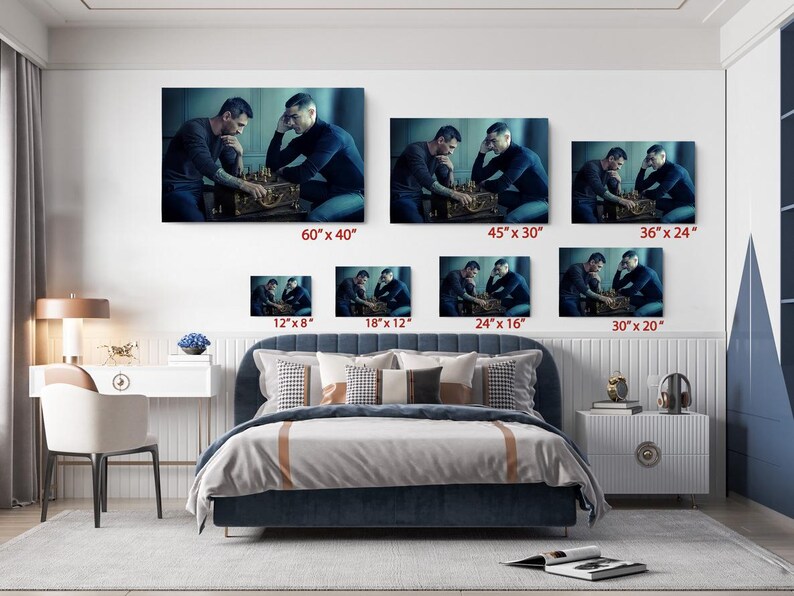 a bed room with a neatly made bed and pictures on the wall
