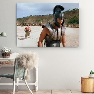 a room with a chair and a table with a picture on it