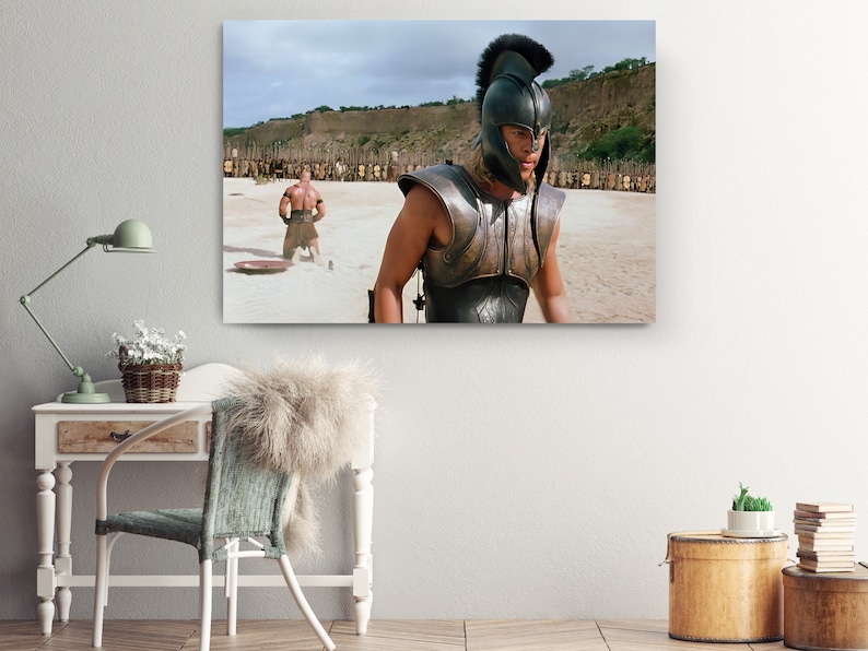 a room with a chair and a table with a picture on it