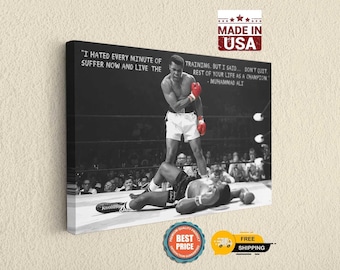 May include: A black and white canvas print featuring Muhammad Ali standing over a fallen opponent in a boxing ring. The text reads: I HATED EVERY MINUTE OF TRAINING, BUT I SAID... DON'T QUIT. SUFFER NOW AND LIVE THE REST OF YOUR LIFE AS A CHAMPION.