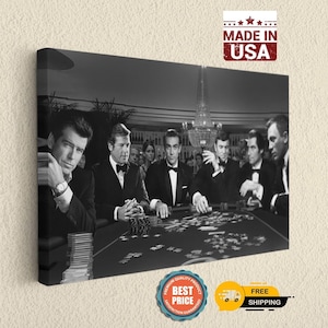May include: A black and white canvas print depicting six men in formal tuxedos sitting around a casino poker table with stacks of chips and cards. The image features a chandelier in the background and includes a red Made in USA stamp.