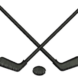 May include: Black embroidered design of two crossed hockey sticks and a hockey puck on a white background. The hockey sticks are angled and intersect, with the puck positioned below the intersection.
