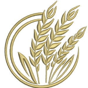 Puede incluir: Un diseño de bordado que presenta tres tallos de trigo en color hilo amarillo dorado, dispuestos dentro de un marco circular compuesto por dos anillos concéntricos. Los tallos de trigo tienen texturas de grano y hojas puntiagudas.