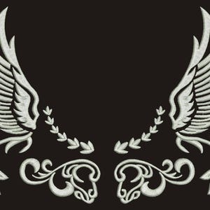 May include: A pair of white embroidered wings with floral accents on a black background.
