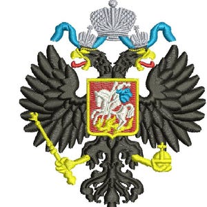 May include: Embroidered emblem featuring a black double-headed eagle with outstretched wings, holding a scepter and orb. The eagle's heads are adorned with crowns and blue ribbons. A central shield displays a knight on horseback.